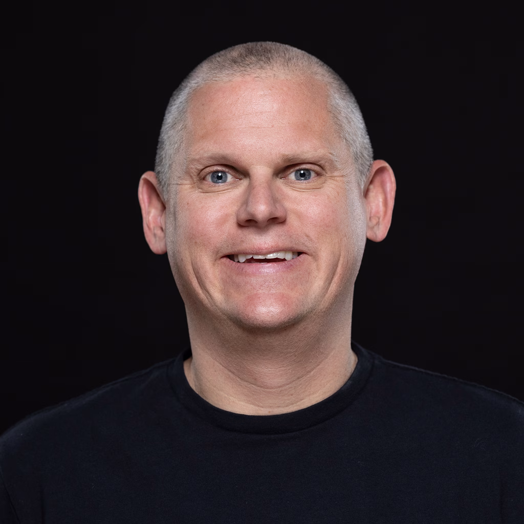 93212e7648bc-Ted_Murphy_AI_0001s_0002s_0011_Portrait_Facing_Forward_Smiling_on_Black_Background_5